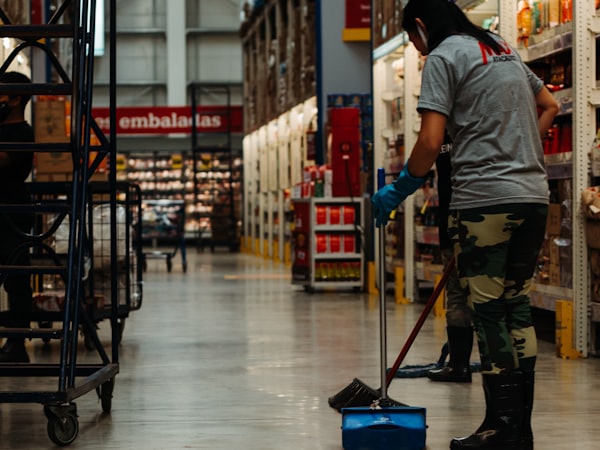 Cleaning crew deep-cleaning the floors of a large facility